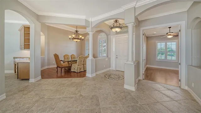 a large kitchen with stainless steel appliances granite countertop a sink stove and refrigerator