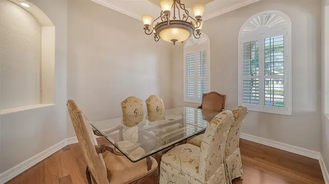 a kitchen with stainless steel appliances granite countertop a stove top oven a sink a counter space and cabinets