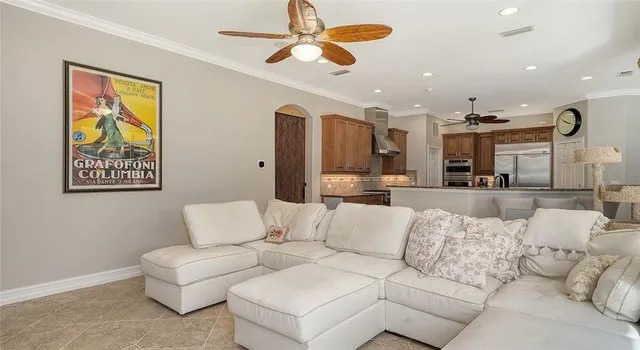 a view of a dining room with furniture wooden floor and a chandelier
