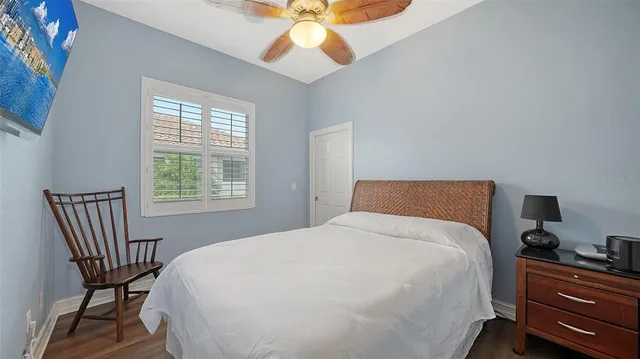 an aerial view of residential houses with outdoor space and lake view