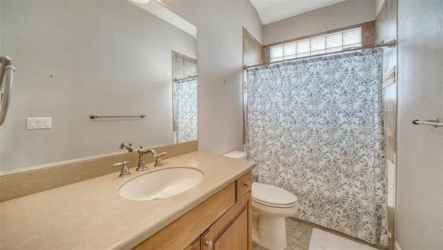 an aerial view of a house with a ocean view