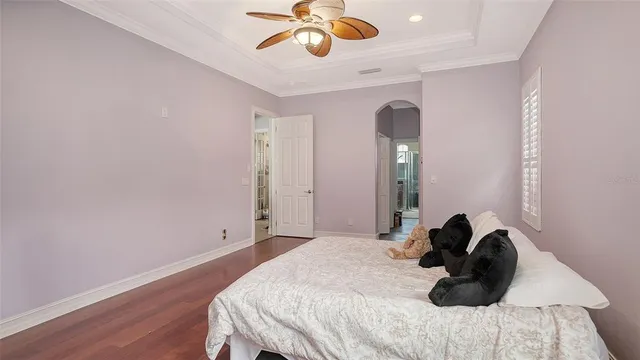 a front view of a house with a yard and potted plants