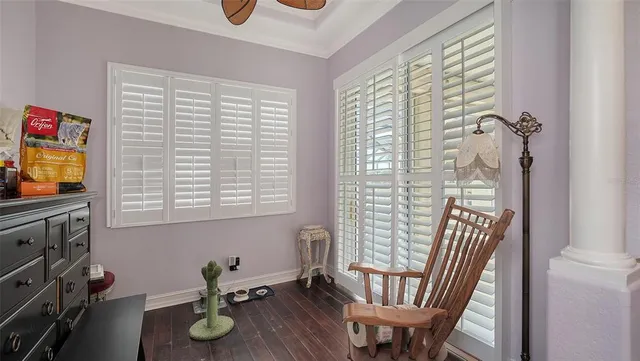 a view of living room with furniture and wooden floor