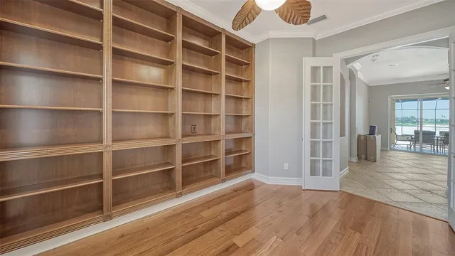 a view of a balcony with wooden floor and lake view