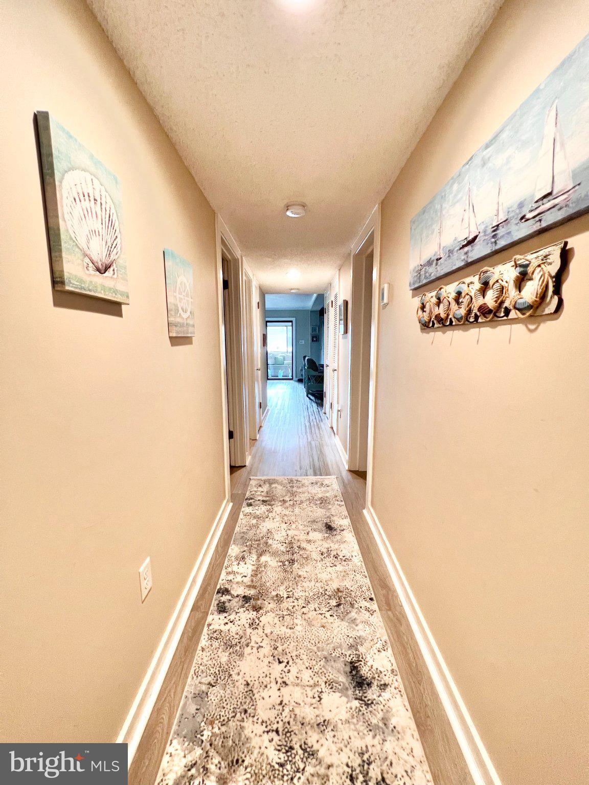 119 Old Landing Road, Unit 102F5 Ocean City, MD 21842 - Photo 3 of 19 Inviting coastal-inspired hallway.