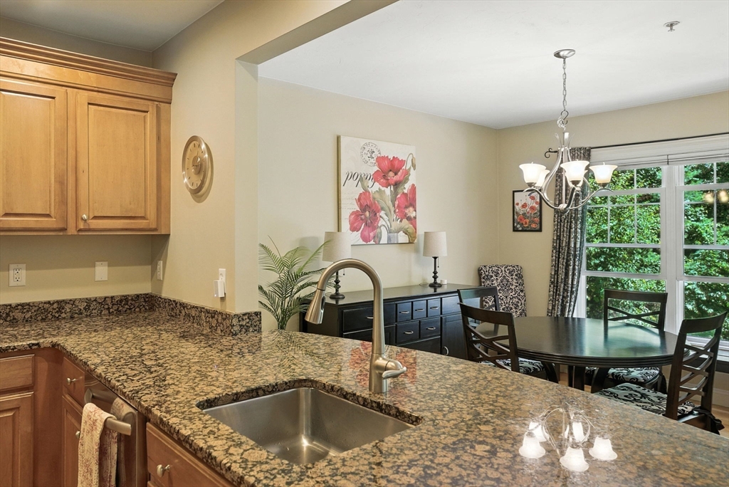 5 Trail Ridge Way, Unit C Harvard, MA 01451 - Photo 11 of 26 a kitchen with a stove a sink and a refrigerator