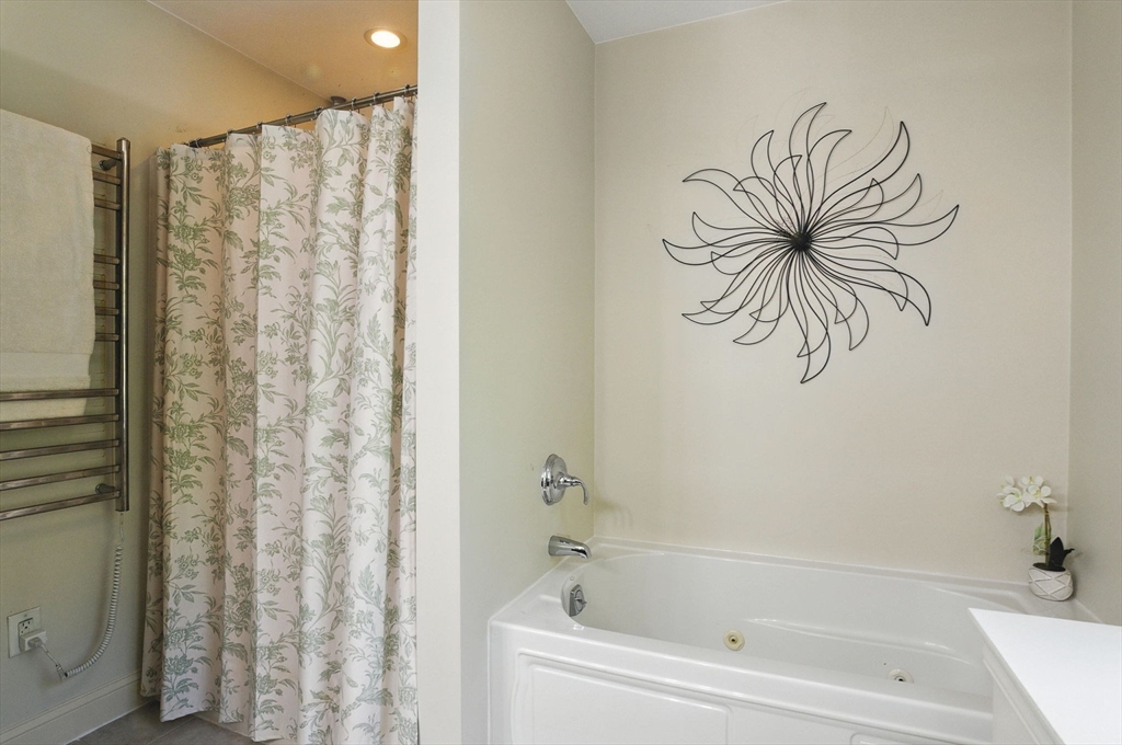 5 Trail Ridge Way, Unit C Harvard, MA 01451 - Photo 20 of 26 a bathroom with a bathtub and a shower