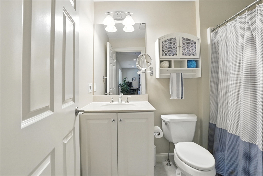 5 Trail Ridge Way, Unit C Harvard, MA 01451 - Photo 22 of 26 a bathroom with a toilet a sink and a mirror