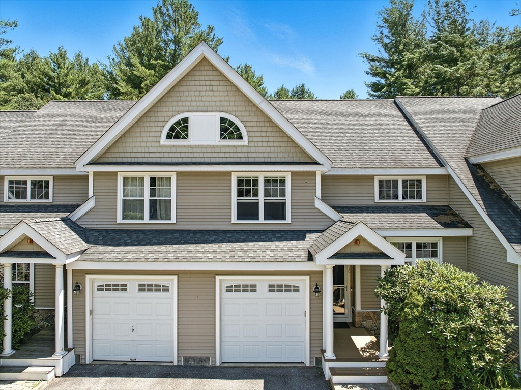 5 Trail Ridge Way, Unit C Harvard, MA 01451 - Photo 24 of 26 a front view of a house with a yard