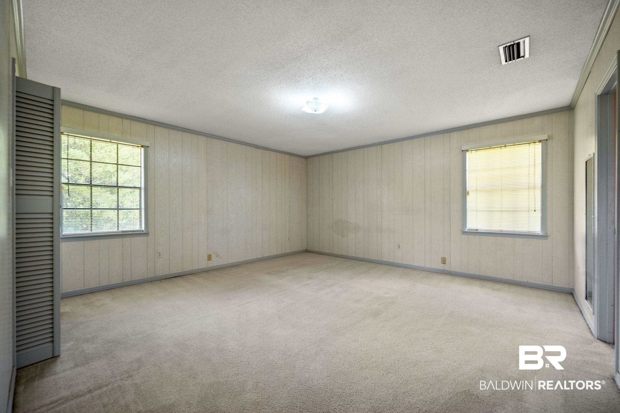 15880 Pine Grove Rd Extension West Bay Minette, AL 36507 - Photo 30 of 44 Unfurnished room with a textured ceiling and light colored carpet