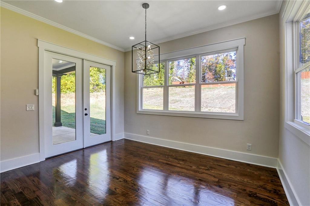 3629 Centerville Rosebud Road Snellville, GA 30039 - Photo 20 of 54 a view of an empty room with wooden floor and a window