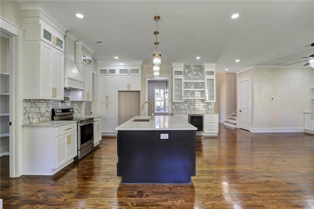 3629 Centerville Rosebud Road Snellville, GA 30039 - Photo 22 of 54 a large kitchen with kitchen island a island in it
