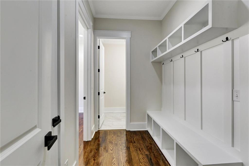 3629 Centerville Rosebud Road Snellville, GA 30039 - Photo 24 of 54 a hallway with wooden floor and staircase