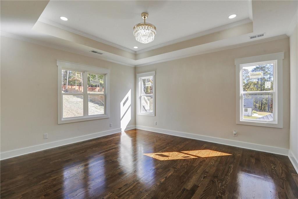 3629 Centerville Rosebud Road Snellville, GA 30039 - Photo 29 of 54 a view of a room with wooden floor and windows