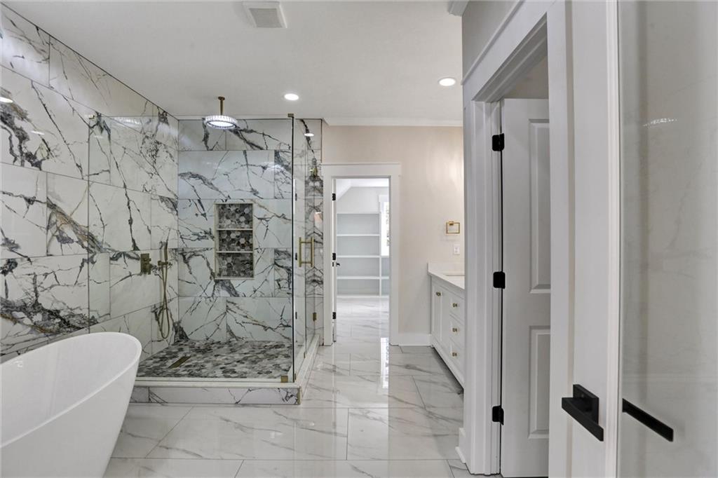 3629 Centerville Rosebud Road Snellville, GA 30039 - Photo 32 of 54 a bathroom with a shower and a toilet