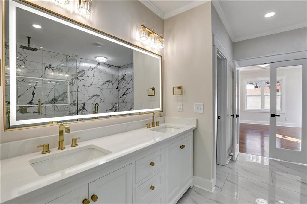 3629 Centerville Rosebud Road Snellville, GA 30039 - Photo 35 of 54 a bathroom with a sink double vanity and a mirror
