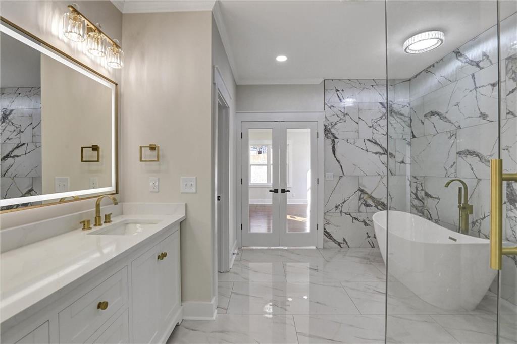 3629 Centerville Rosebud Road Snellville, GA 30039 - Photo 36 of 54 a bathroom with a sink and mirror