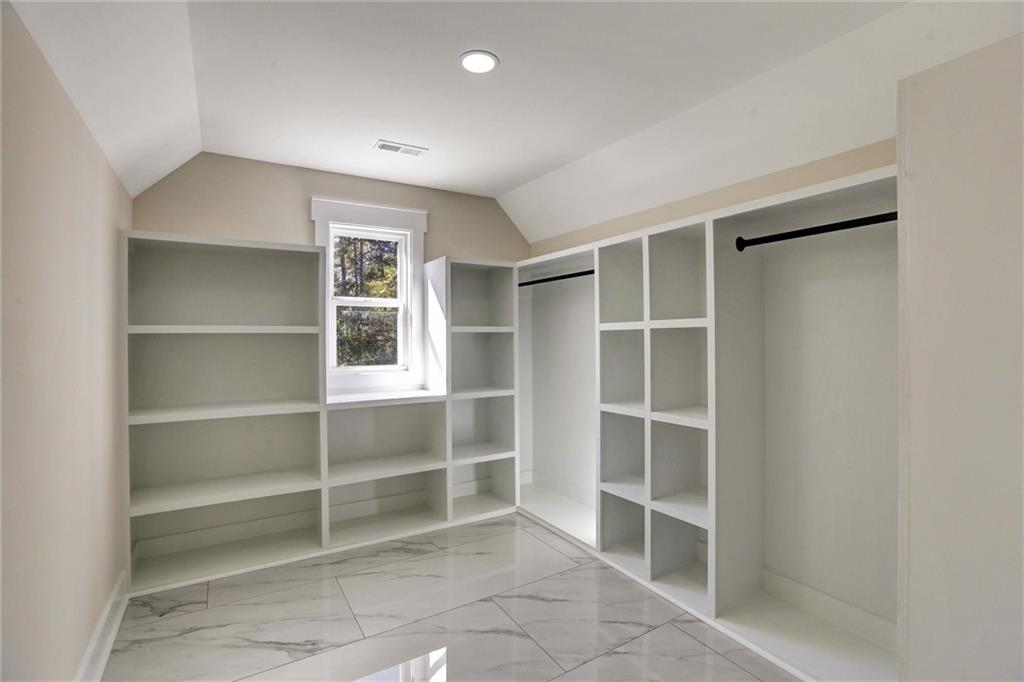 3629 Centerville Rosebud Road Snellville, GA 30039 - Photo 38 of 54 a view of an empty room with a empty space and empty shelves