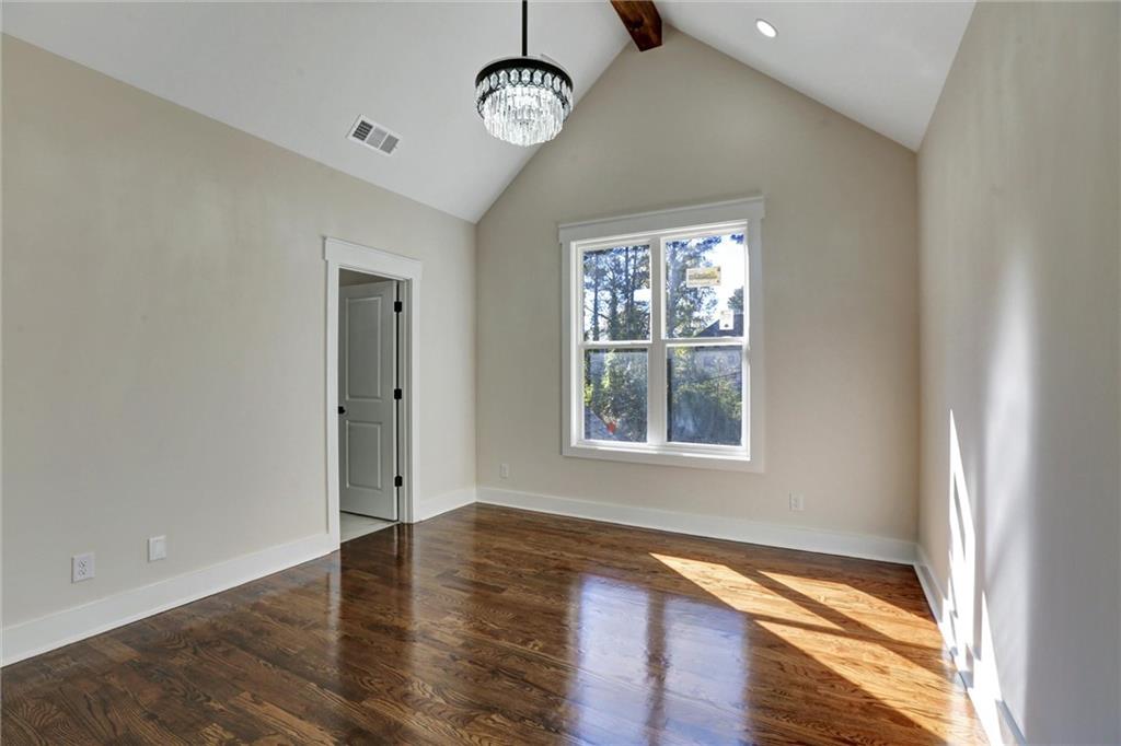3629 Centerville Rosebud Road Snellville, GA 30039 - Photo 45 of 54 a view of an empty room with wooden floor and a window