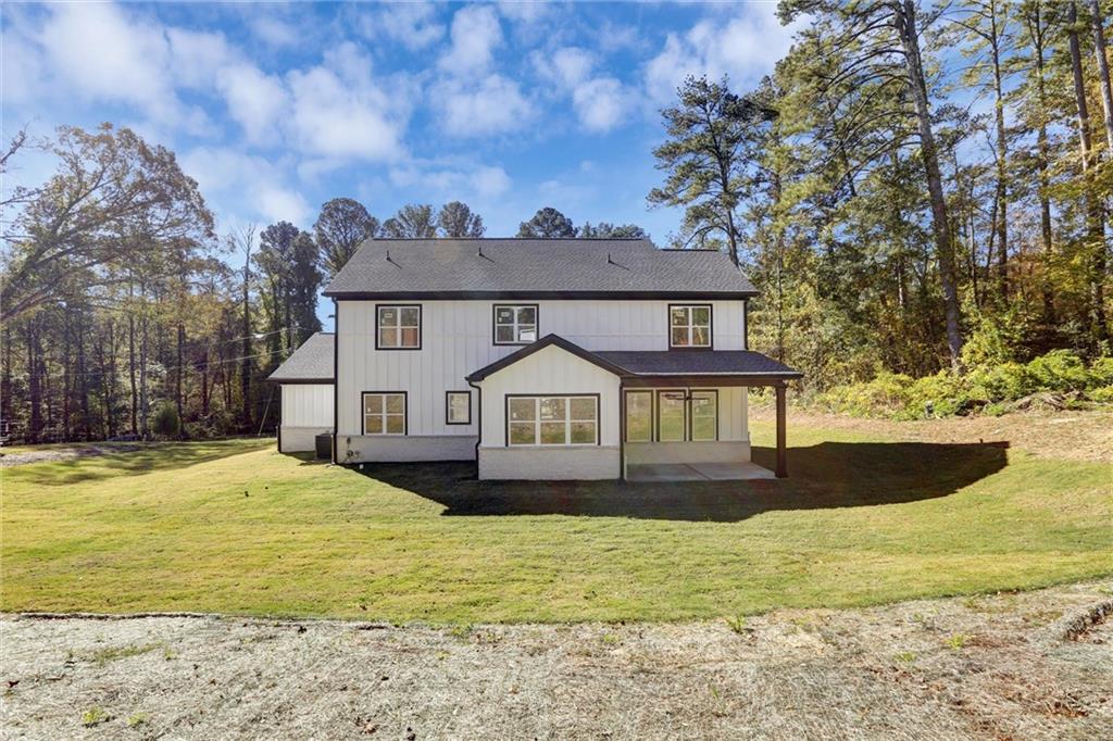 3629 Centerville Rosebud Road Snellville, GA 30039 - Photo 49 of 54 a front view of a house with a yard