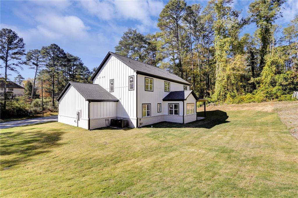 3629 Centerville Rosebud Road Snellville, GA 30039 - Photo 51 of 54 a view of a house with a big yard and large tree