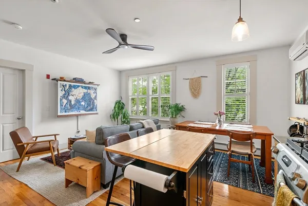 a view of a dining room with furniture window and outside view