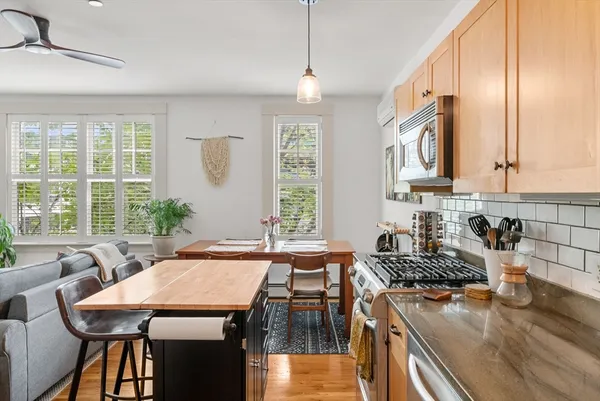 a kitchen with a stove a sink and a refrigerator