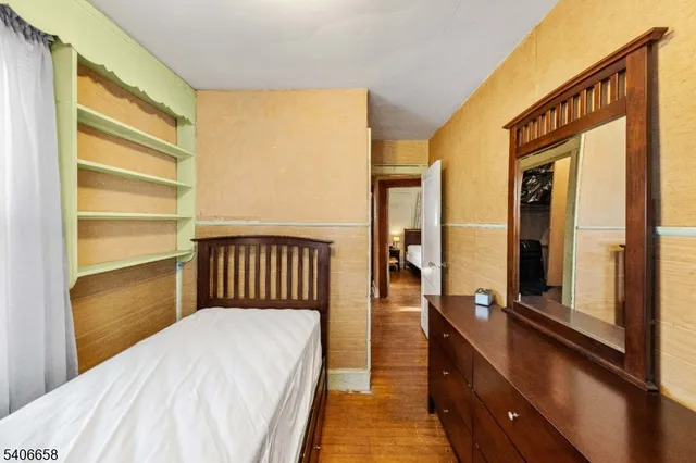 a balcony view with a large window and furniture