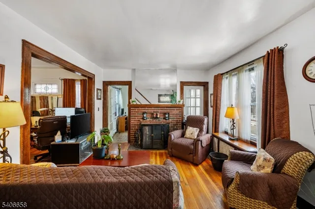 a bedroom with a bed a couch and dresser