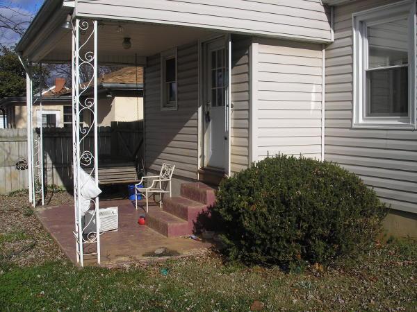 3220 Oliver Road Northeast Roanoke, VA 24012 - Photo 2 of 10 a view of a house with a large window and potted plants