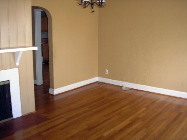 3220 Oliver Road Northeast Roanoke, VA 24012 - Photo 4 of 10 a view of an empty room with wooden floor and a window