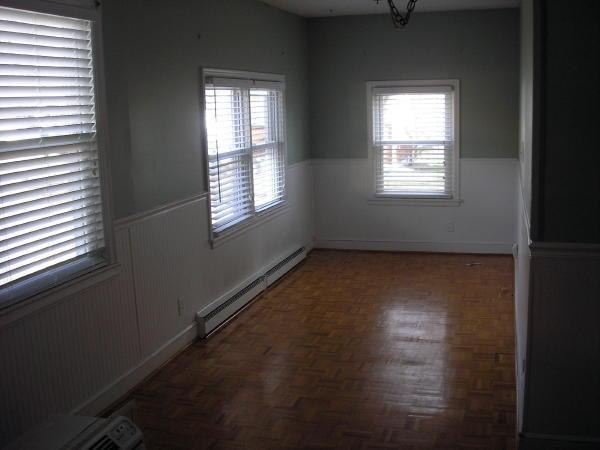 3220 Oliver Road Northeast Roanoke, VA 24012 - Photo 7 of 10 a view of an empty room with wooden floor and a window