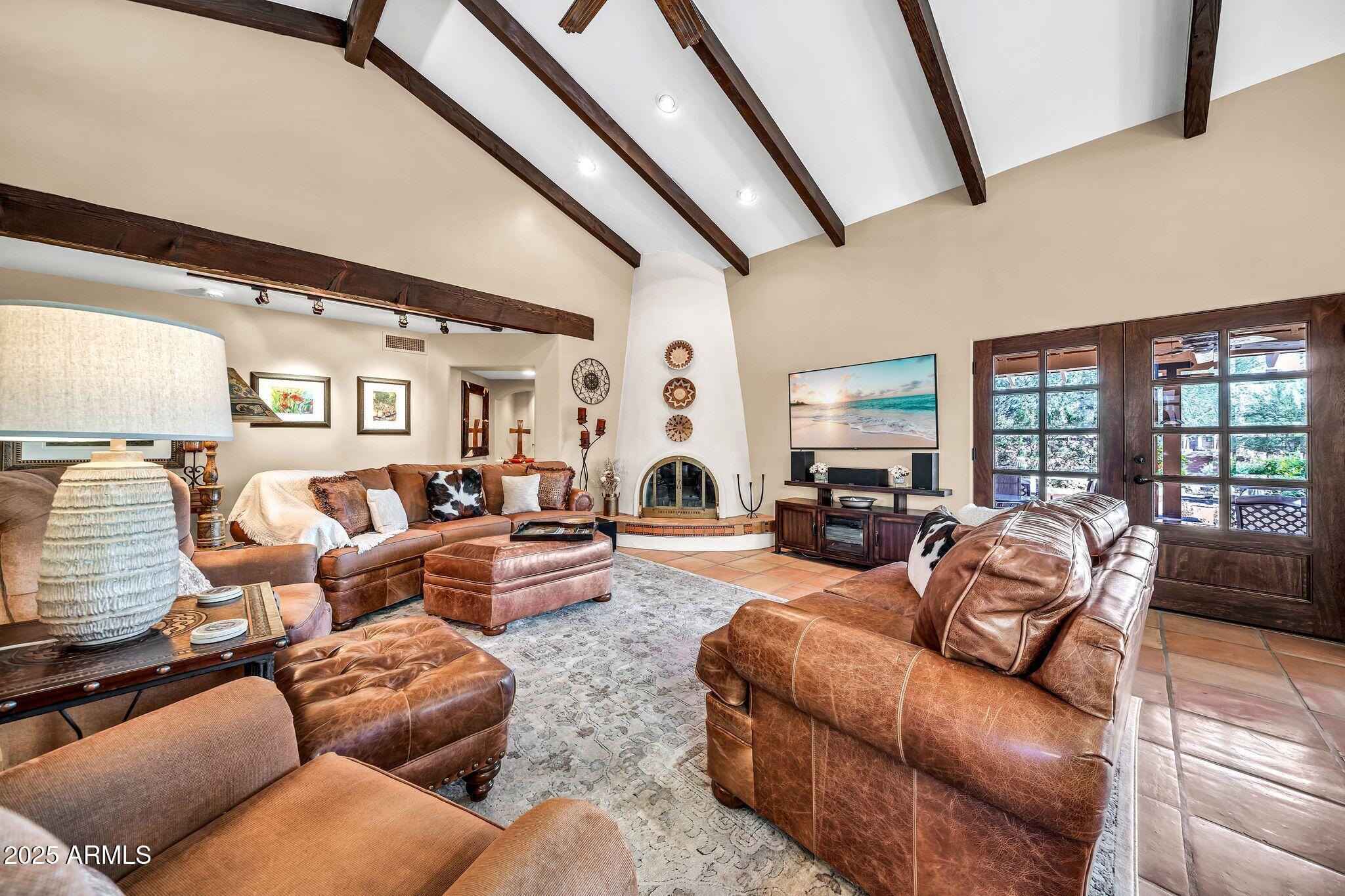 18532 East Horseshoe Bend Rio Verde, AZ 85263 - Photo 5 of 38 a living room with furniture fireplace and large windows