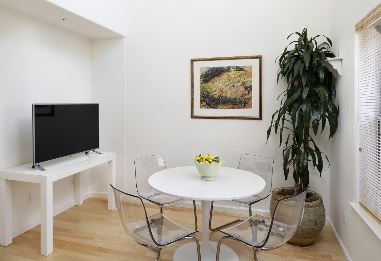 113 Pacchetti Way Mountain View, CA 94040 - Photo 6 of 20 a view of a workspace with furniture and a potted plant