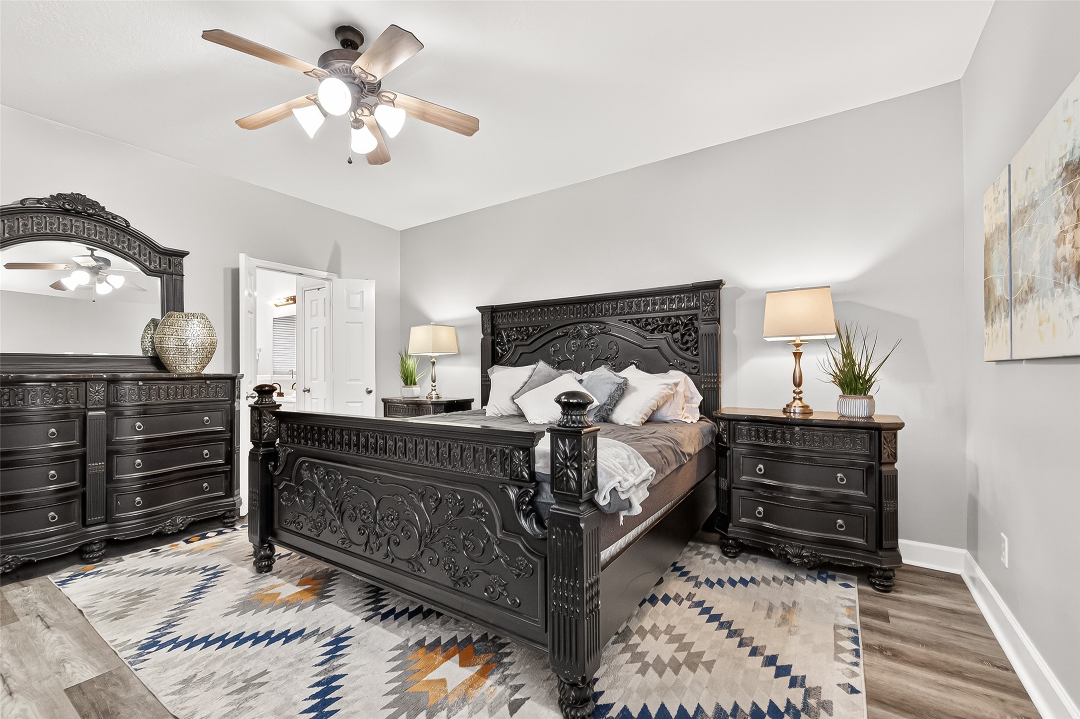7415 Riven Oaks Court Cypress, TX 77433 - Photo 22 of 42 Another view of the spacious downstairs primary retreat privately situated for added comfort and relaxation, featuring an en suite bath with a soaking tub, dual vanities, and a spa-like atmosphere.