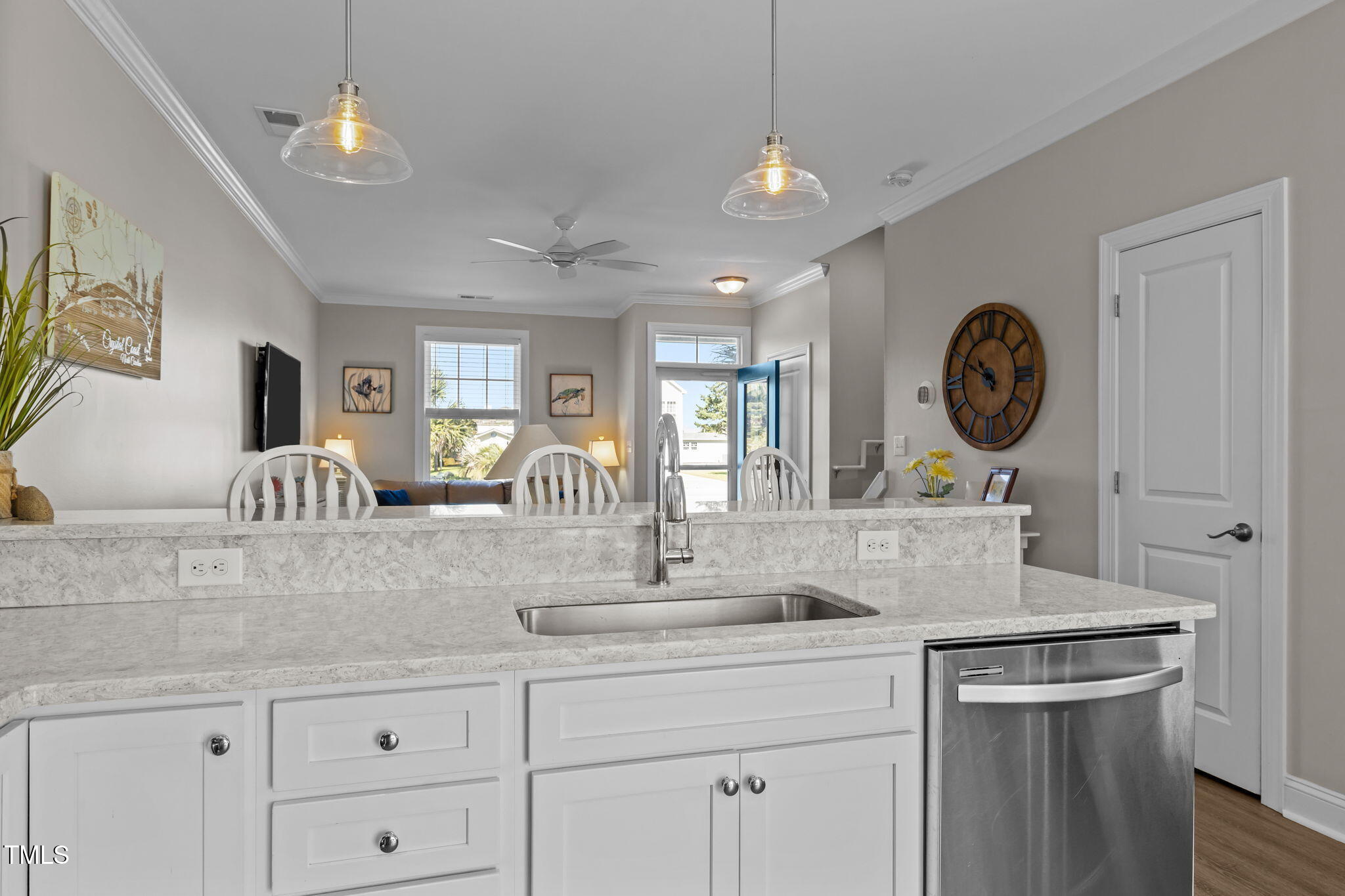 2800 West Fort Macon Road, Unit 37 Atlantic Beach, NC 28512 - Photo 10 of 39 a kitchen with a sink dishwasher a clock and cabinets