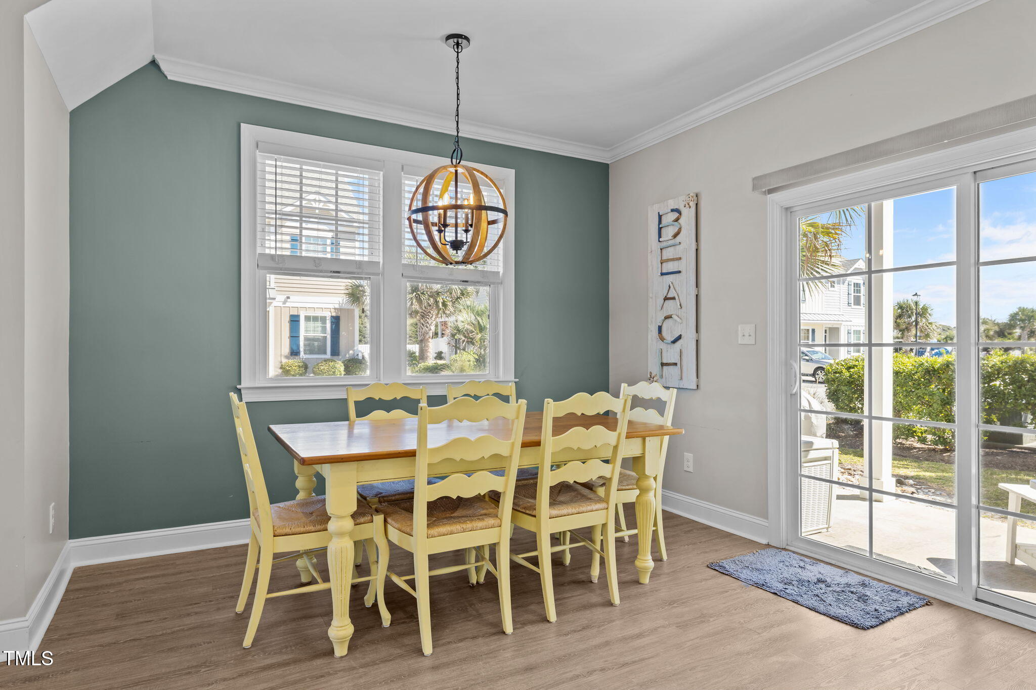 2800 West Fort Macon Road, Unit 37 Atlantic Beach, NC 28512 - Photo 11 of 39 a view of a dining room with furniture window and wooden floor