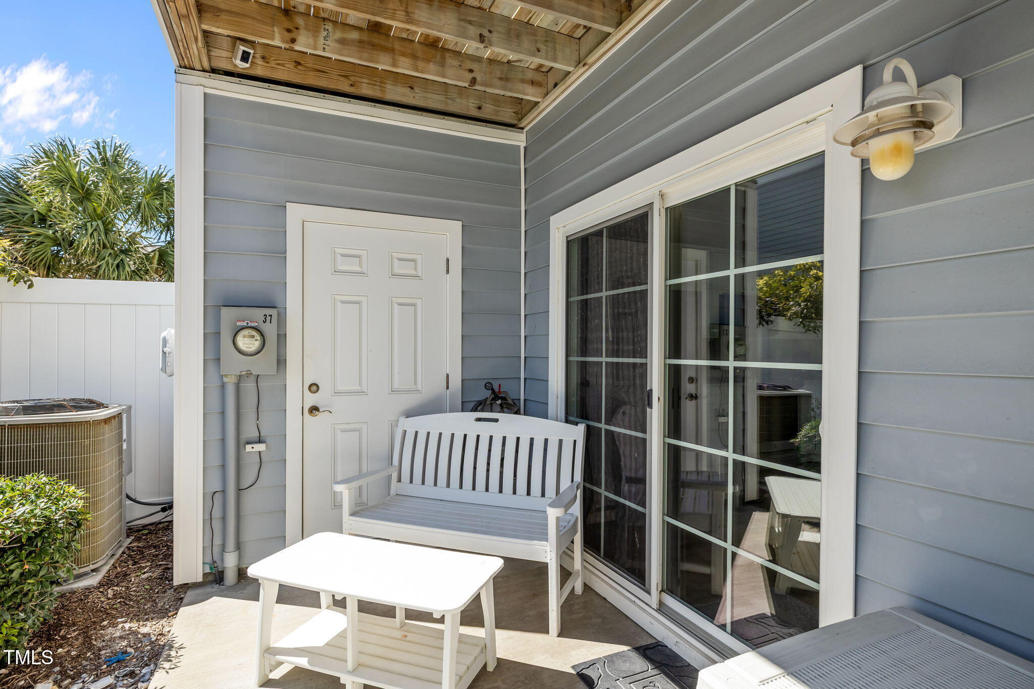 2800 West Fort Macon Road, Unit 37 Atlantic Beach, NC 28512 - Photo 14 of 39 a view of a balcony with chair and floor to ceiling window