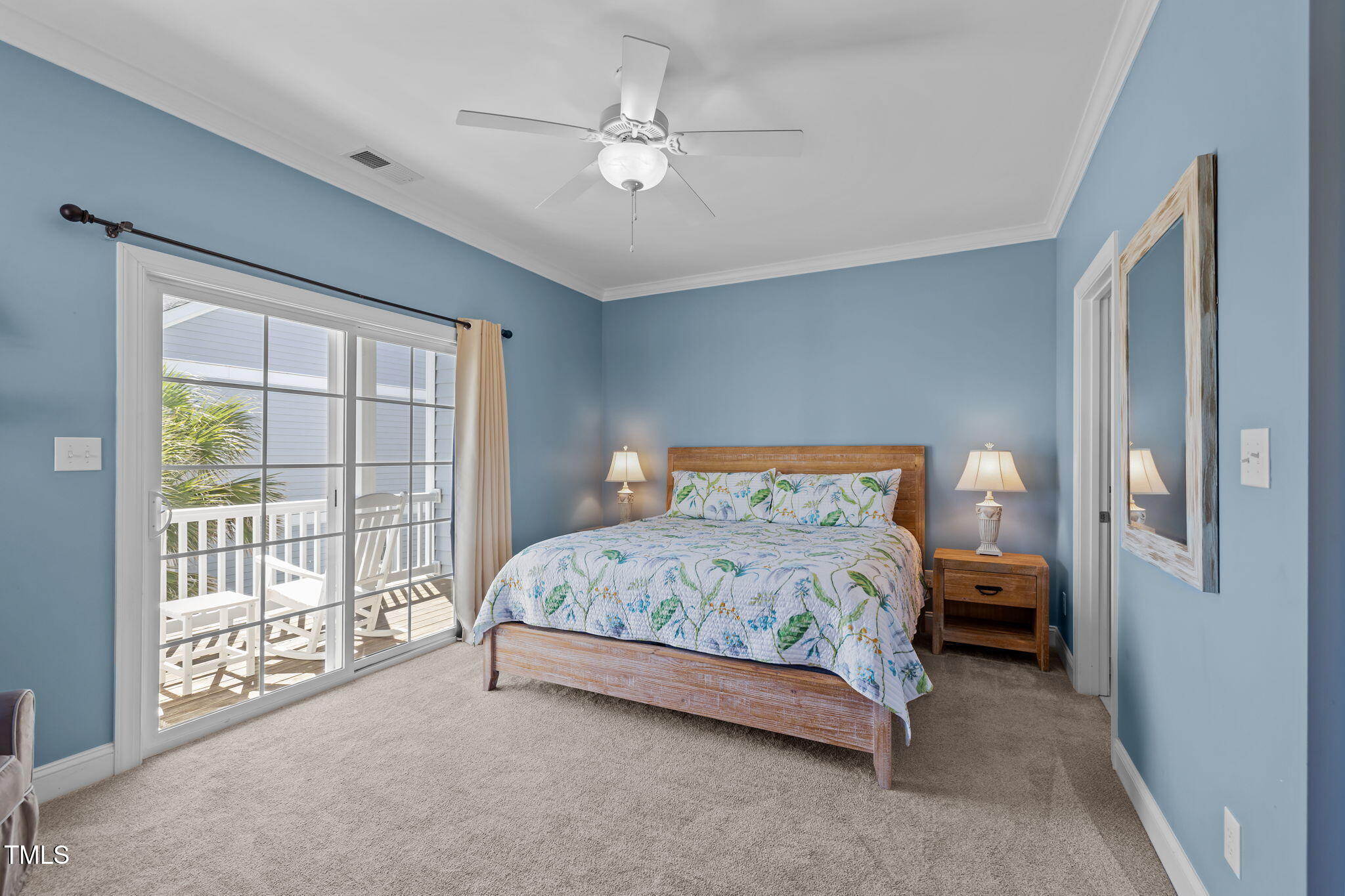 2800 West Fort Macon Road, Unit 37 Atlantic Beach, NC 28512 - Photo 19 of 39 a bedroom with a large bed and a chandelier fan