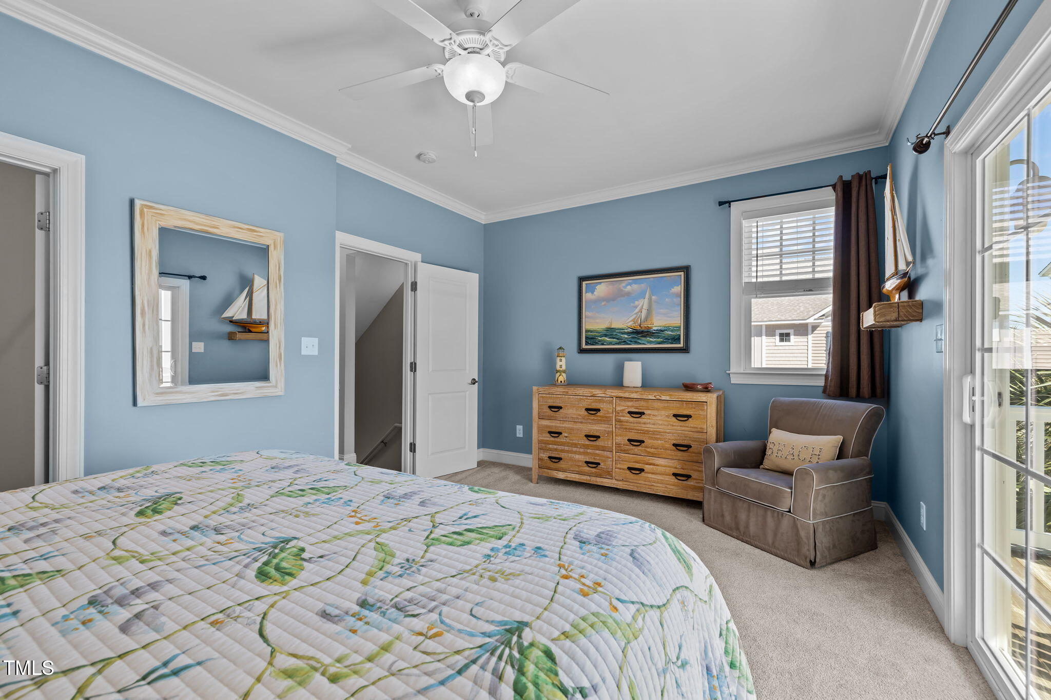 2800 West Fort Macon Road, Unit 37 Atlantic Beach, NC 28512 - Photo 20 of 39 a bedroom with a bed and a chandelier