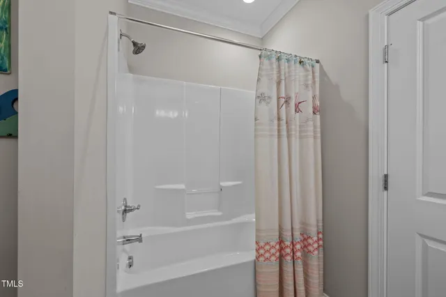 a bathroom with a shower and a tub