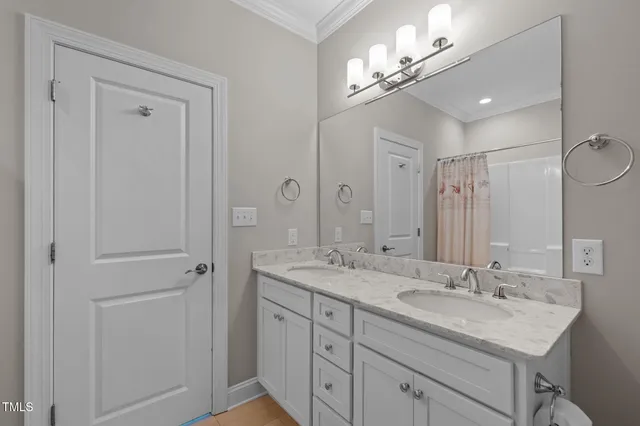 a bathroom with 2 sink and a mirror