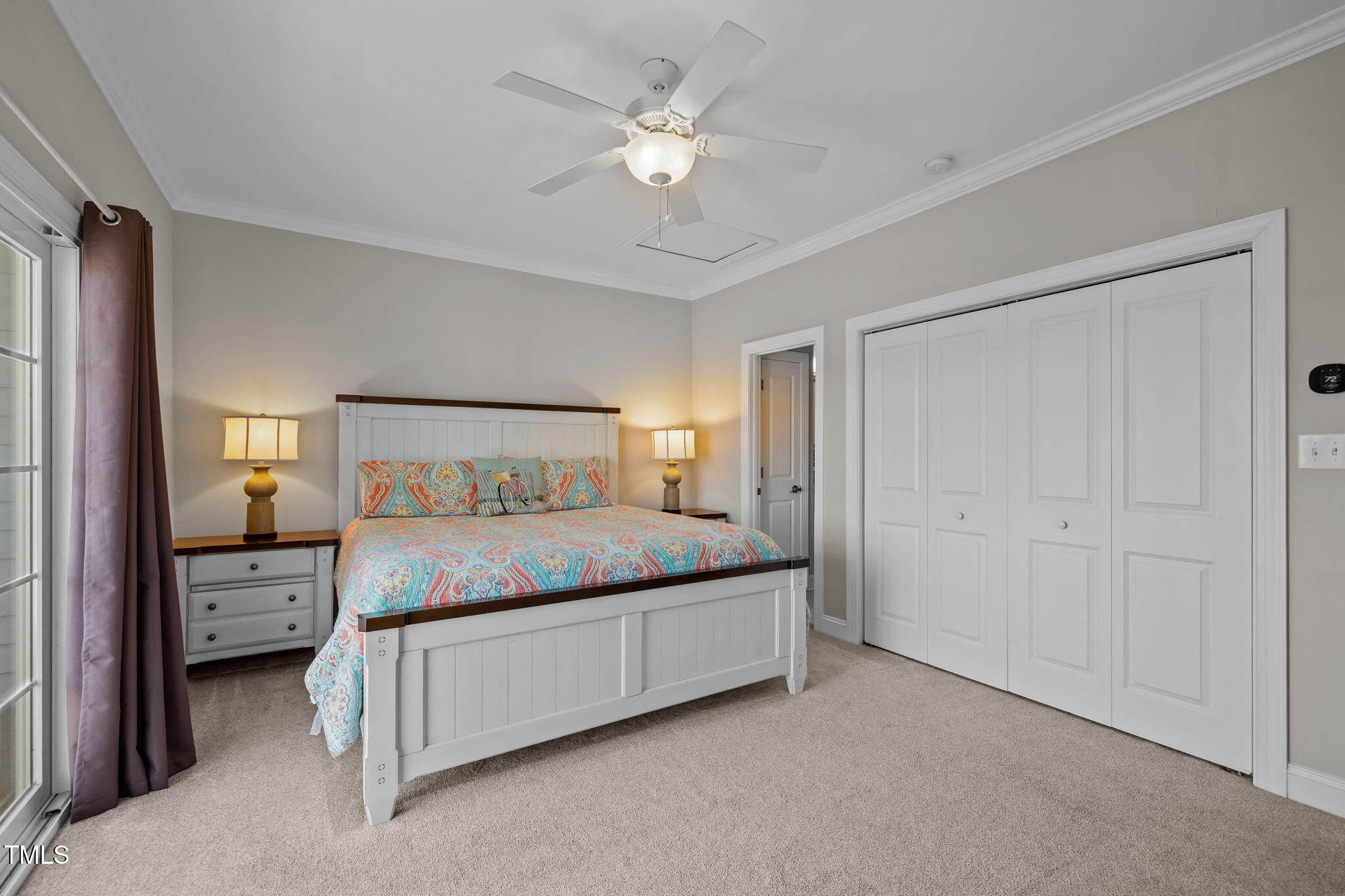 2800 West Fort Macon Road, Unit 37 Atlantic Beach, NC 28512 - Photo 25 of 39 a bedroom with a bed and a chandelier