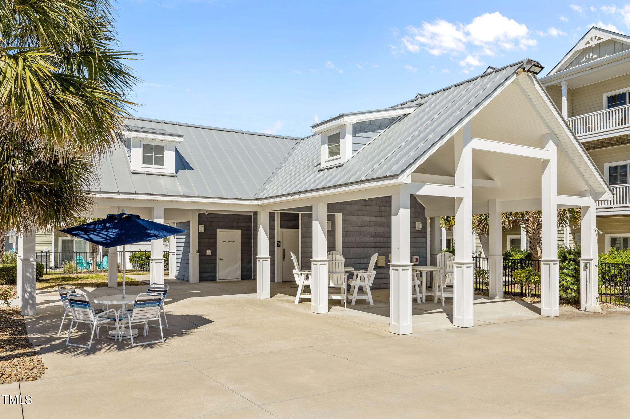 2800 West Fort Macon Road, Unit 37 Atlantic Beach, NC 28512 - Photo 31 of 39 a view of a patio with table and chairs and potted plants