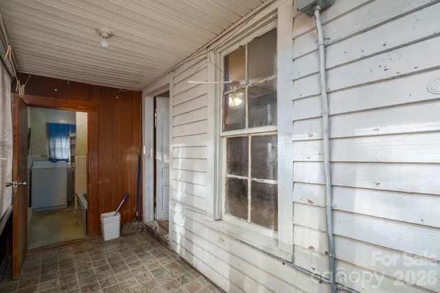 an aerial view of residential building and car parked on street side view