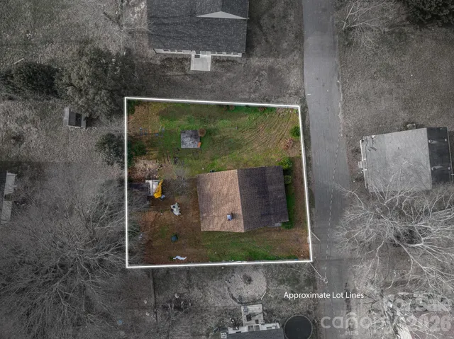 a view of house with backyard of house