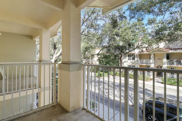 a view of a brick house with a large window