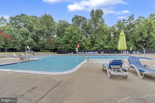 a view of a swimming pool with a lounge chair
