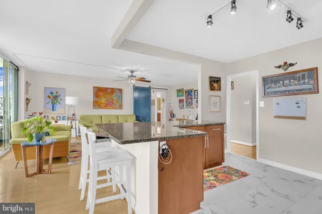 a living room with granite countertop furniture and a dining table