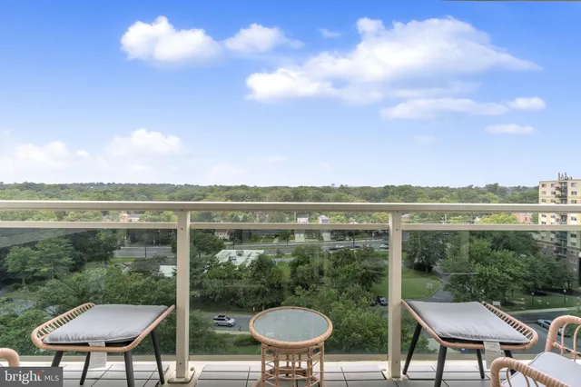 a view of a balcony with chairs